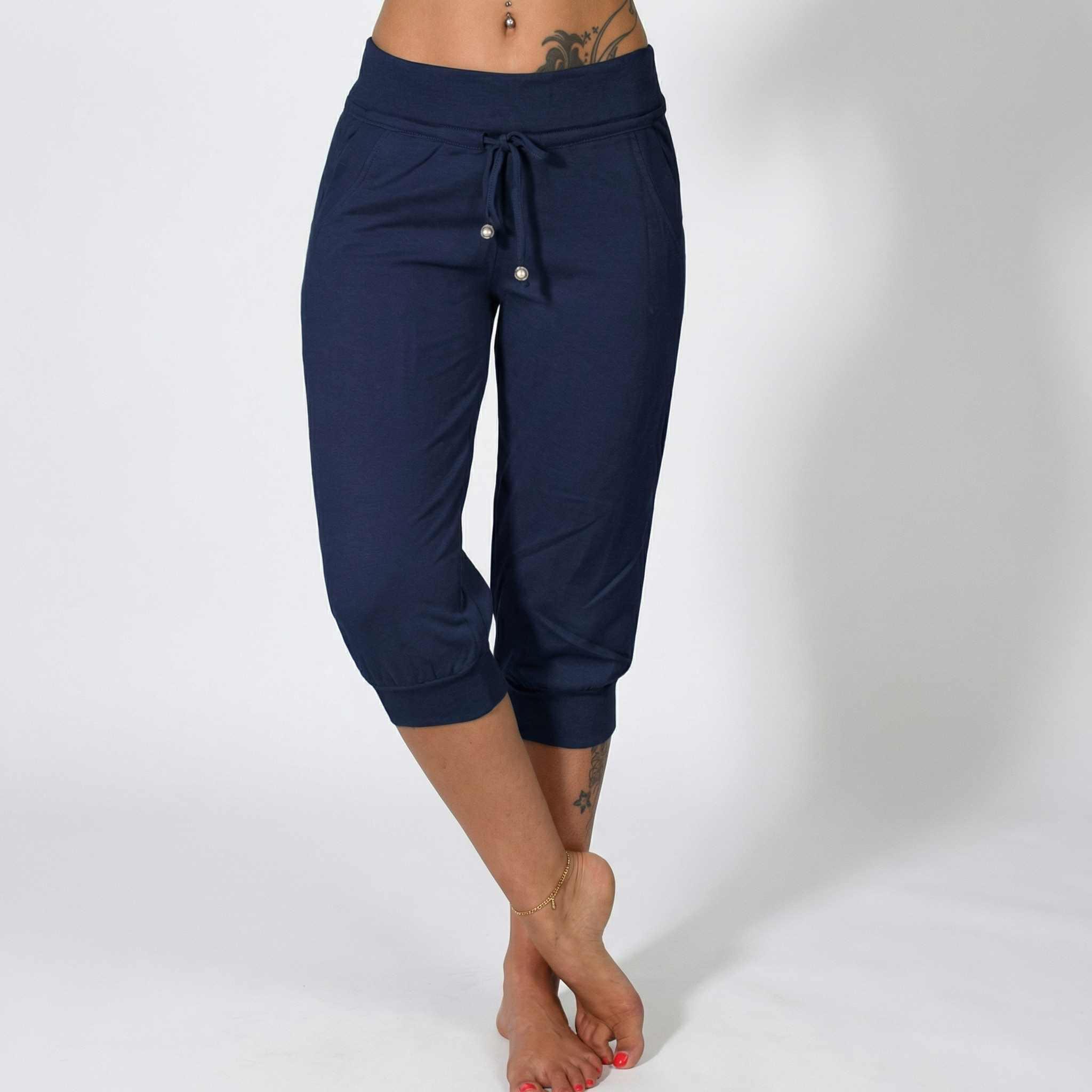 Īsas treniņbikses ar aukliņu jostasvietā